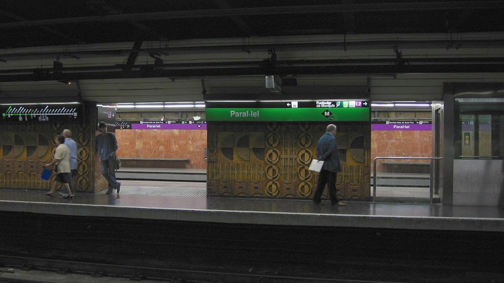 Inside a busy Barcelona metro station platform