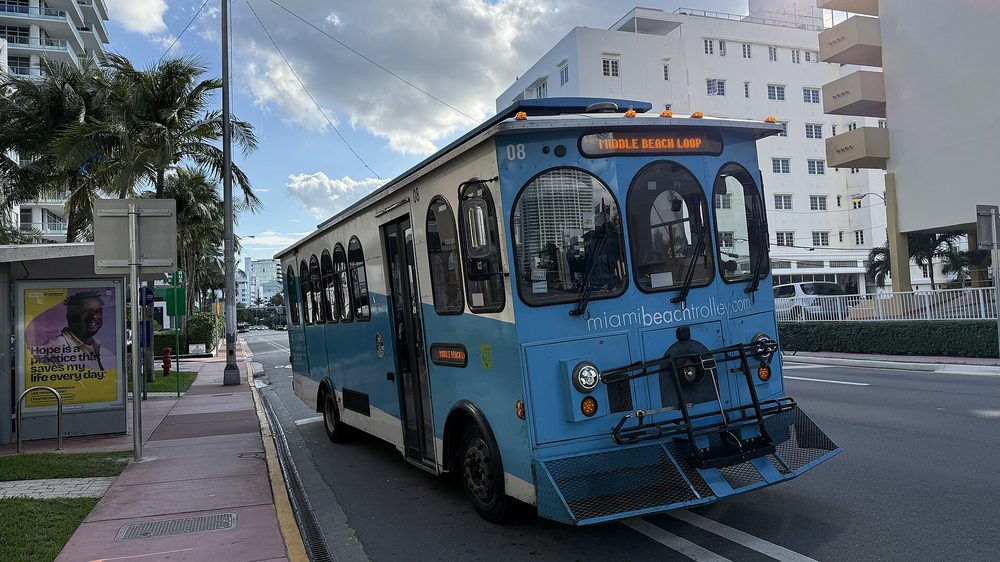 Catching the free Miami Beach trolley along the island