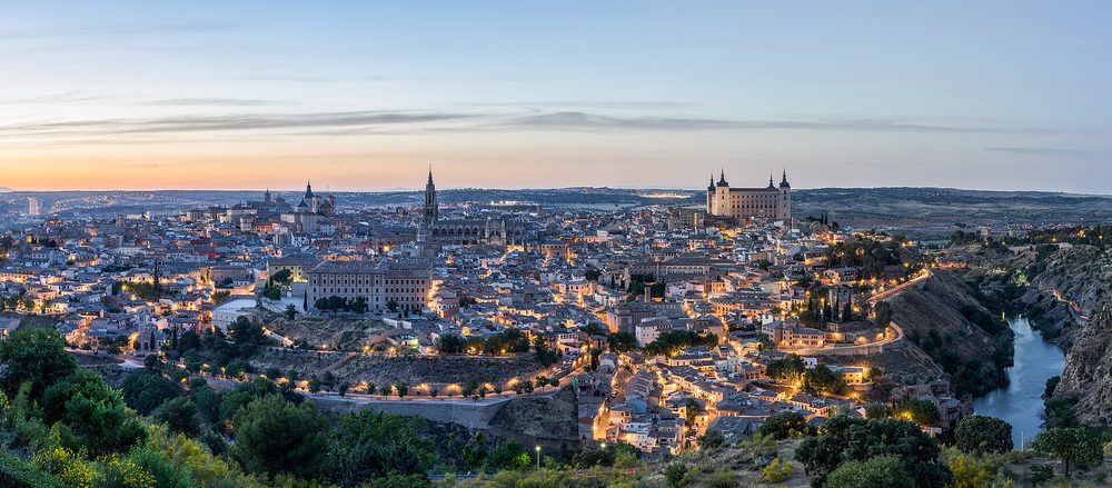 Navigating a narrow street in Toledo by car